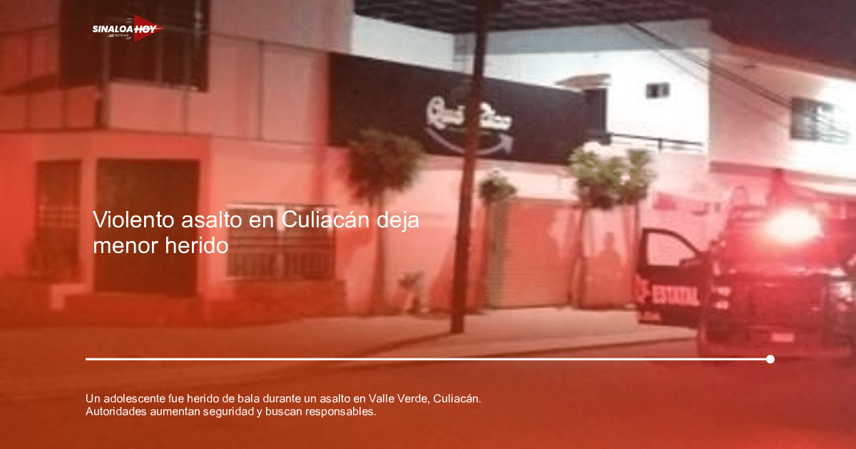 Edificio en Valle Verde iluminado por luces de emergencia, con vehículo de seguridad estacionado.