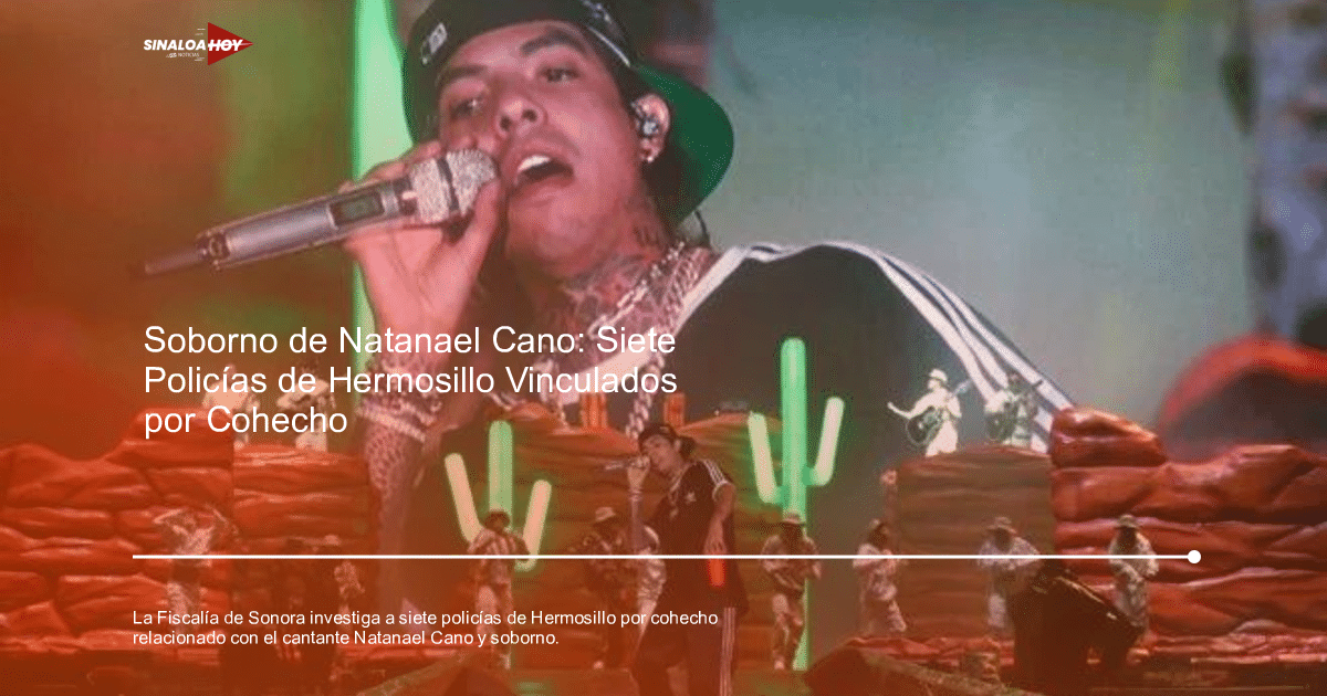 Natanael Cano cantando en un concierto con músicos y escenografía de rocas y cactáceas iluminadas.