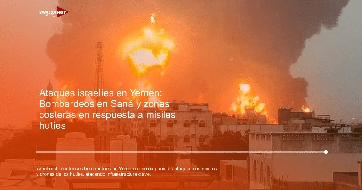 Gran incendio urbano con llamas y humo negro tras bombardeos en Yemen, edificios y torre de telecomunicaciones al fondo.