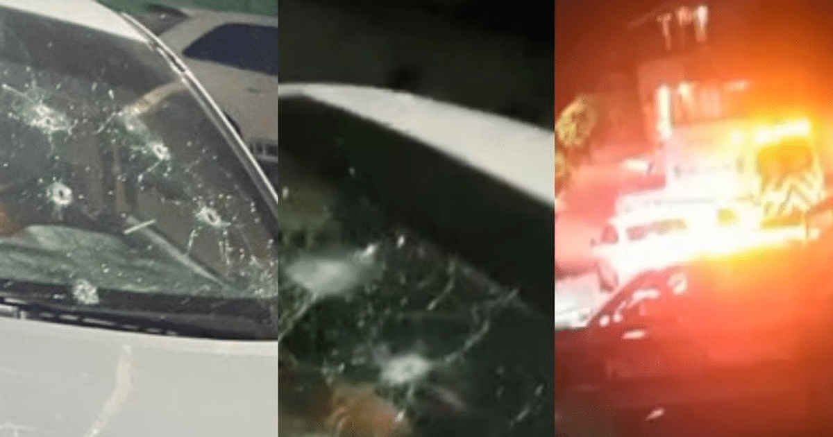 Vehículo con parabrisas dañado por disparos y luces de emergencia en Mazatlán.