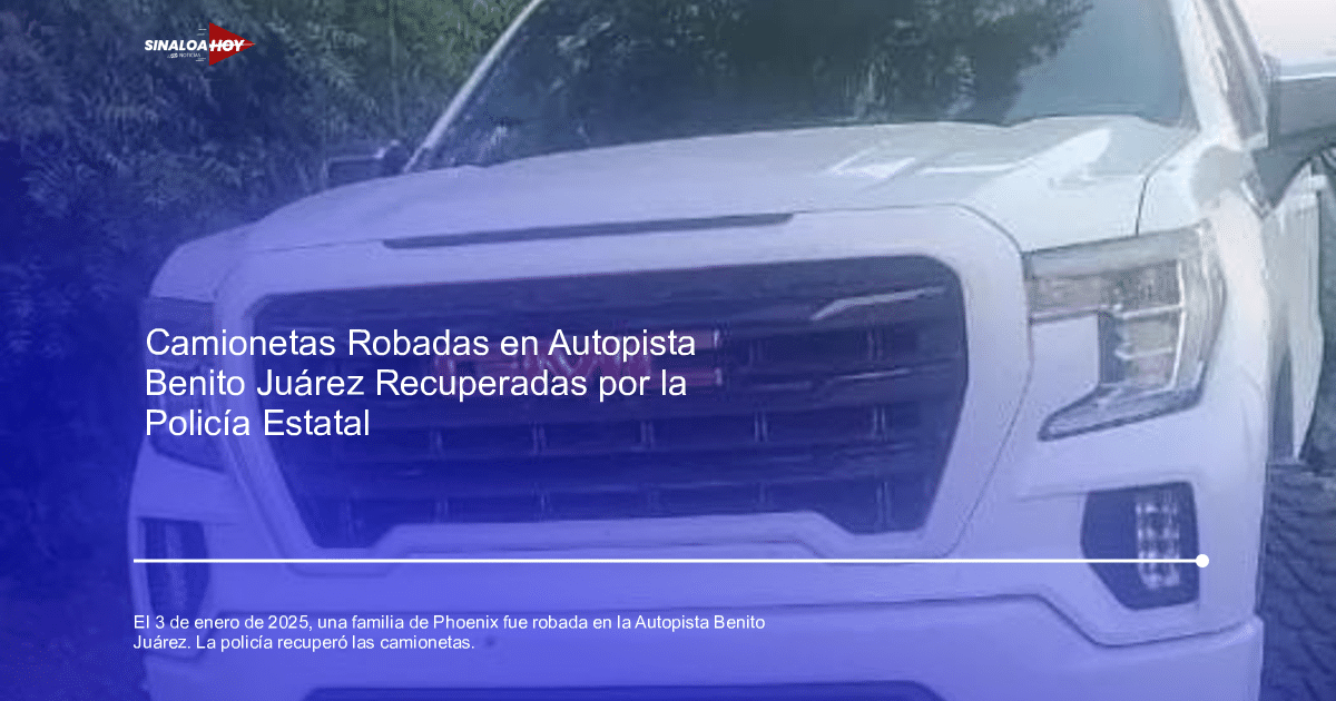 Camioneta GMC Sierra blanca con parrilla negra y logotipo rojo, rodeada de vegetación.