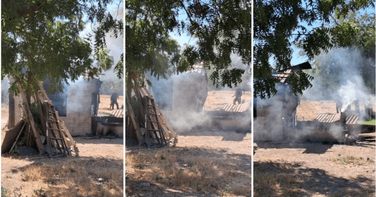 Incendio en Punta Azul de Culiacán con estructura colapsada y humo en el fondo