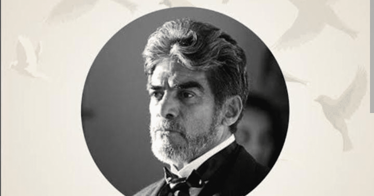 Retrato en blanco y negro de Humberto Yáñez con traje elegante y fondo de aves.