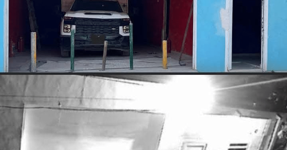 Camioneta estacionada en garaje con paredes azul y rojo, relacionada con operativo de toma clandestina en Mazatlán.