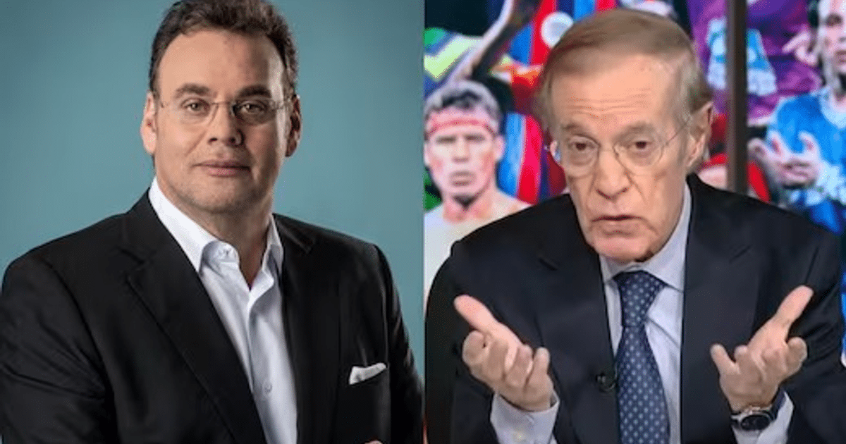 Dos hombres discuten en un evento deportivo, uno con chaqueta negra y otro con traje oscuro, con deportistas al fondo.