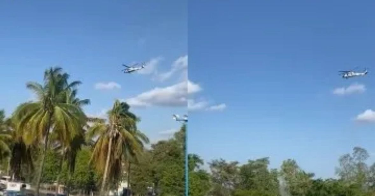 Helicóptero volando sobre cielo azul con nubes y palmeras en Culiacán