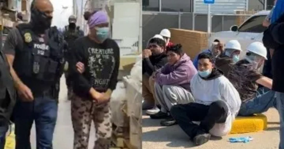 Oficial de policía escolta a un individuo durante redada migratoria en Omaha