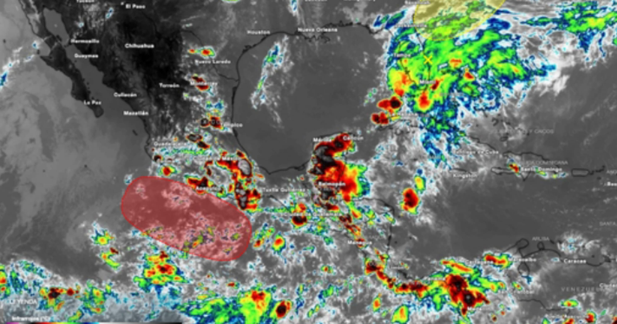 Mapa meteorológico del Caribe y México con áreas de actividad atmosférica en rojo, amarillo y verde, destacando la Onda Tropical 2.