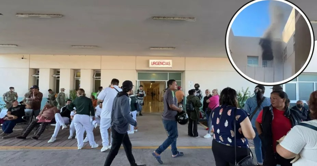 Entrada de Urgencias del Hospital General de Culiacán durante un incendio en la subestación eléctrica, con personas evacuando y humo visible.