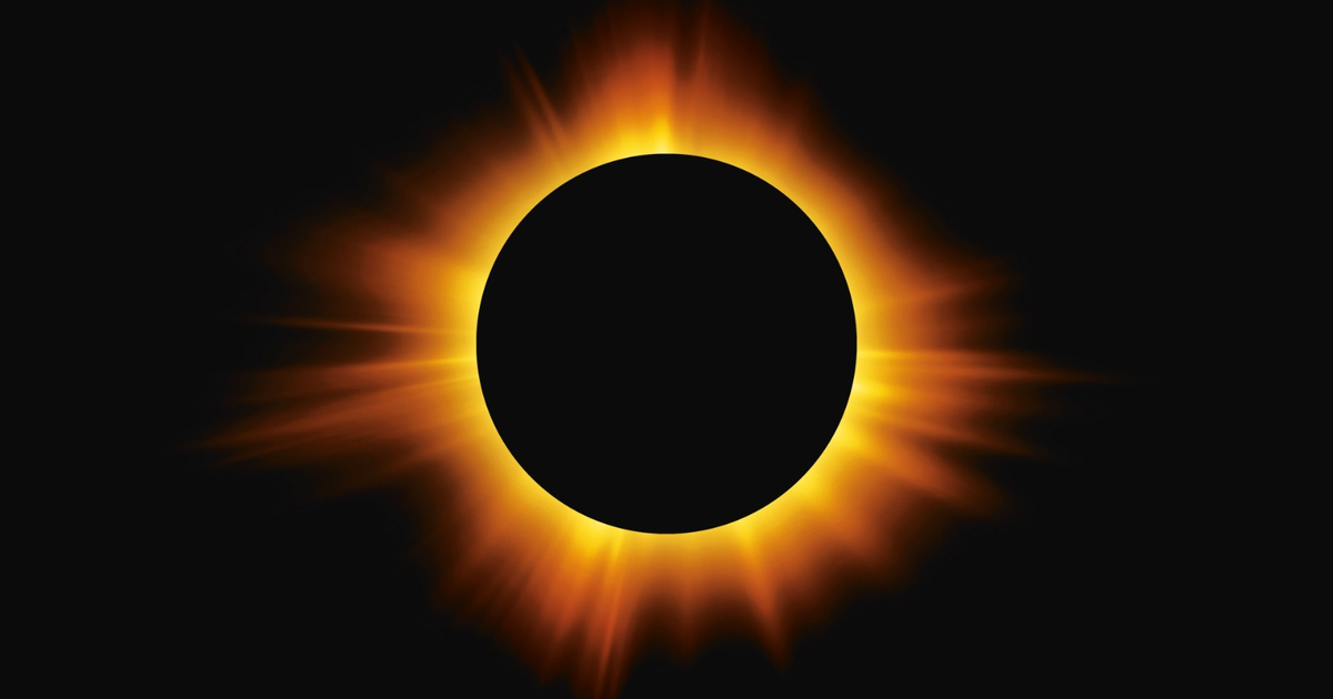 Imagen de un eclipse solar total con la luna cubriendo al sol, rodeada de un resplandor amarillo y naranja.