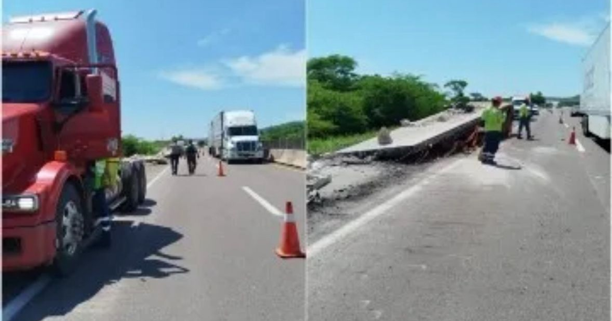 Camión rojo detenido en autopista con sacos de cemento esparcidos y trabajadores en escena