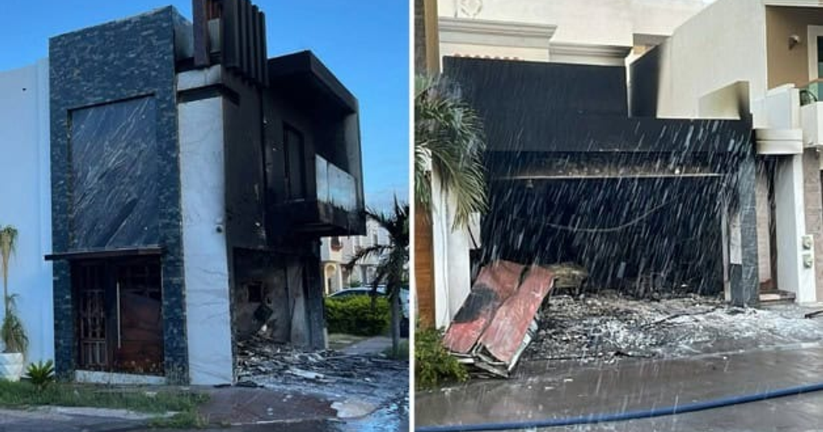 Residencias dañadas por incendio en Culiacán, con paredes ennegrecidas y escombros en la entrada de garage.
