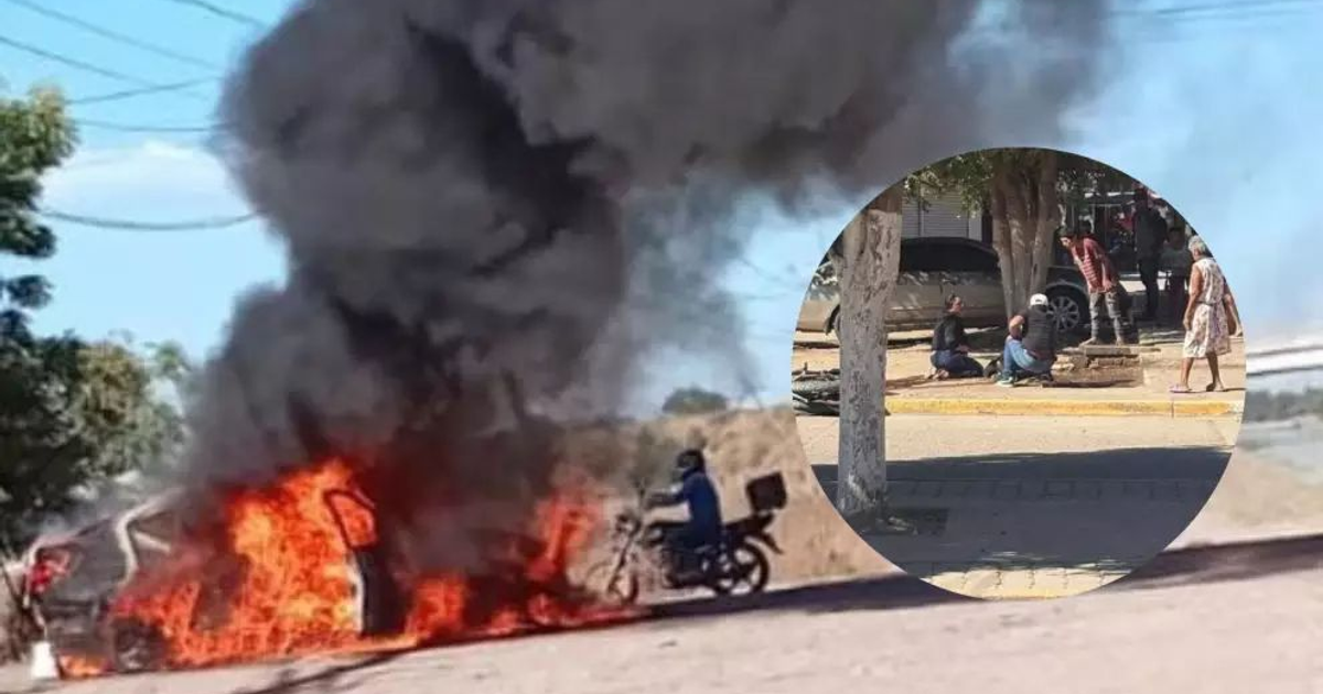 Vehículo incendiado en Navolato tras balacera, con humo negro y un motociclista observando, mientras peatones permanecen ajenos.