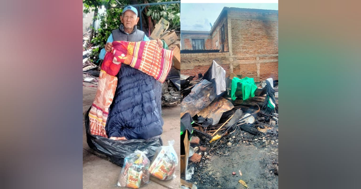 Hombre sosteniendo cobija en zona afectada por incendio en Los Mochis, Sinaloa.