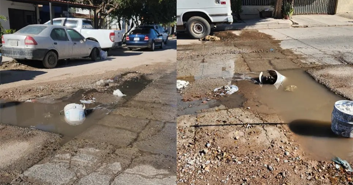 Street in Los Mochis with water waste and trash buildup in a puddle.