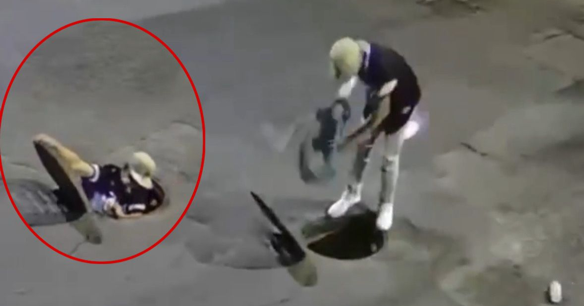 Individuos maniobrando en la calle y alcantarilla en Guadalajara, vinculados a robos y huidas subterráneas.